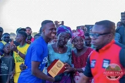 Families celebrating with a player