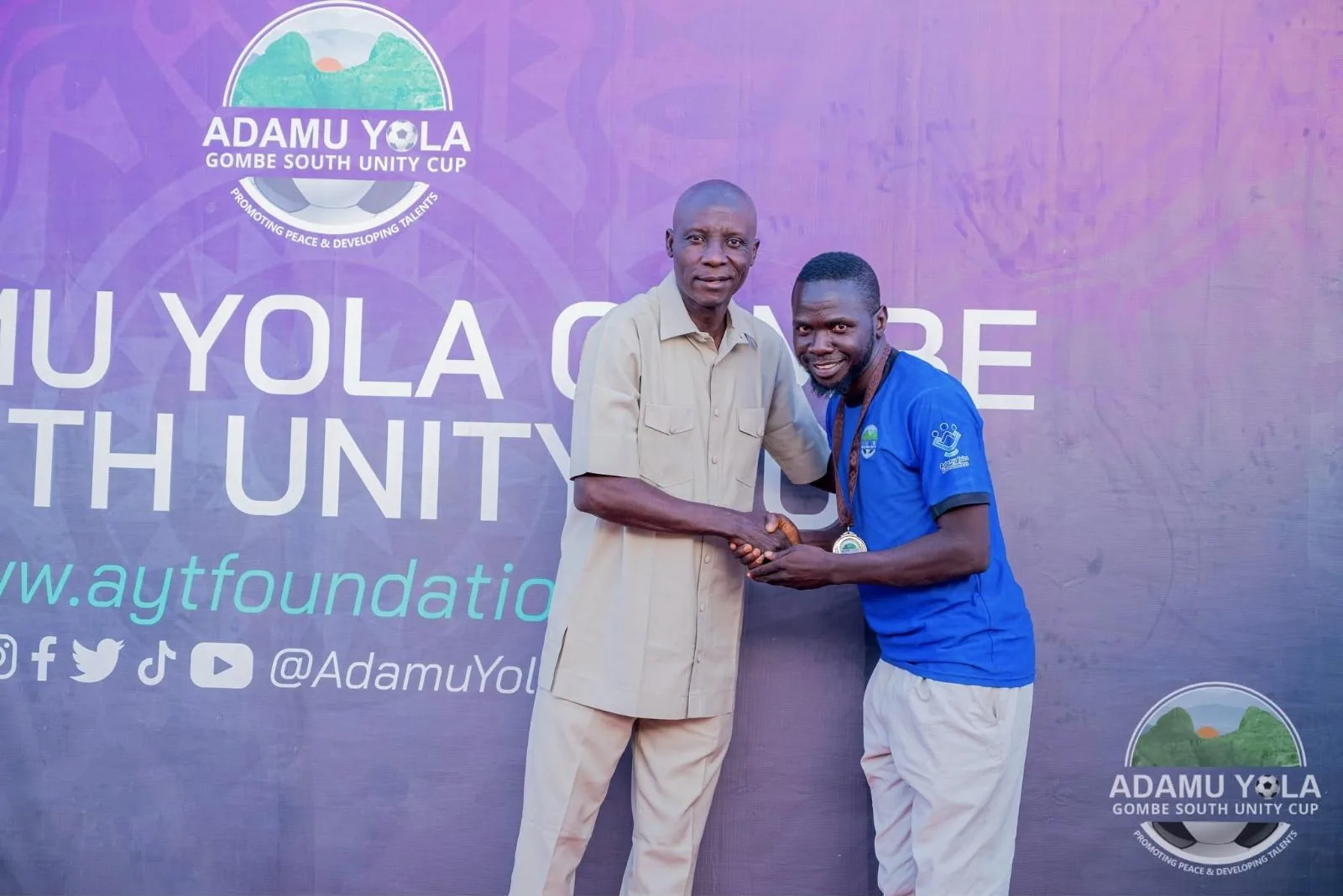 A volunteer receives recognition at the Unity Cup