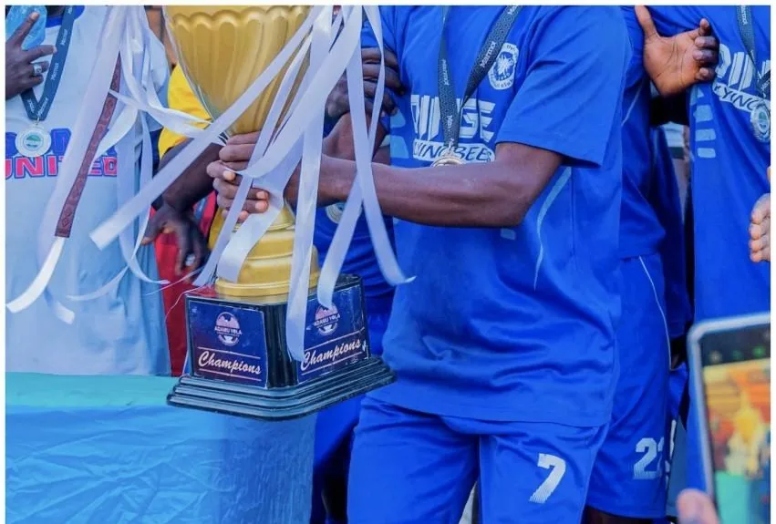 Champions holding the Adamu Yola Unity Cup trophy